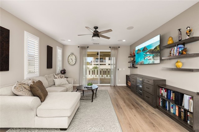 living room with ceiling fan, light wood-style flooring, recessed lighting, visible vents, and baseboards