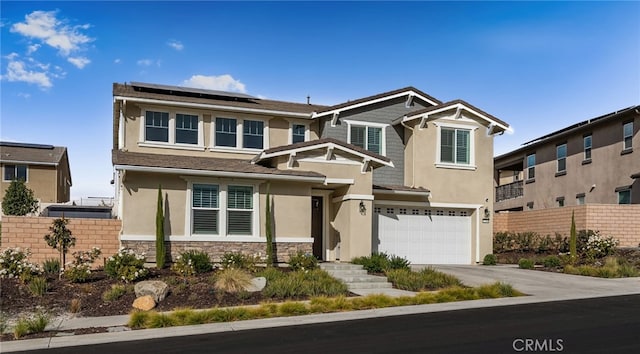 view of front facade with stone siding, fence, solar panels, and stucco siding