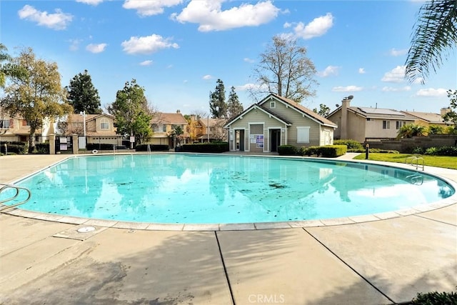 view of swimming pool with a patio area