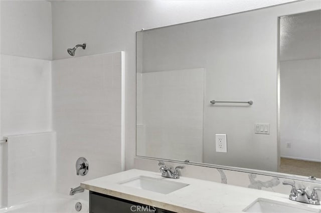 bathroom featuring shower / washtub combination and vanity