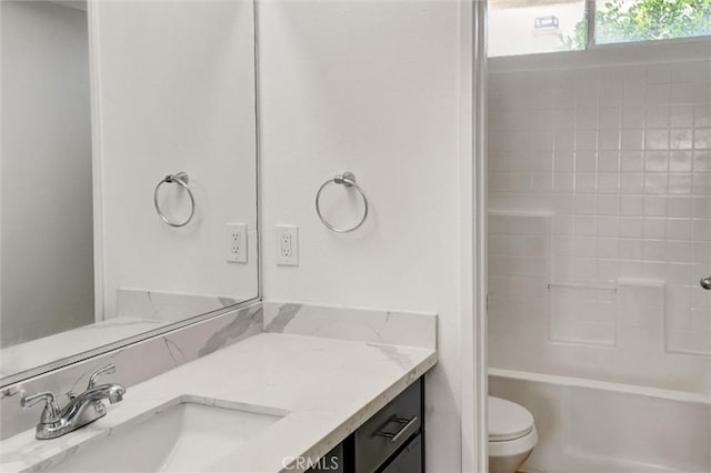 full bathroom with vanity,  shower combination, and toilet