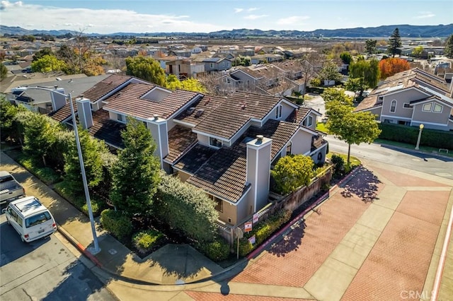 birds eye view of property featuring a mountain view