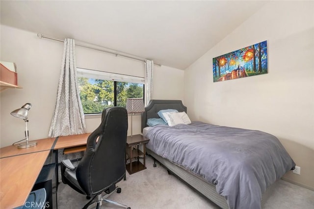 carpeted bedroom featuring vaulted ceiling