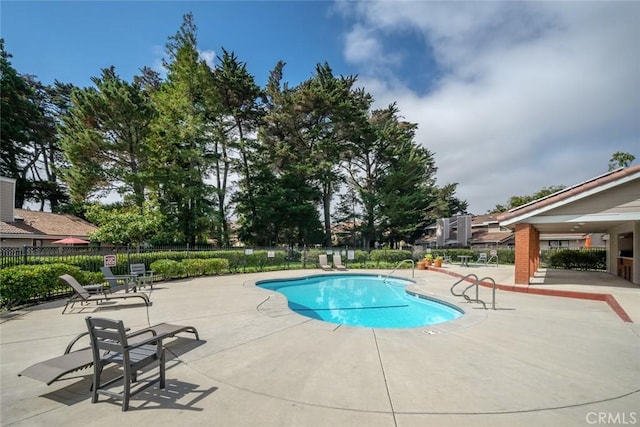 view of pool featuring a patio