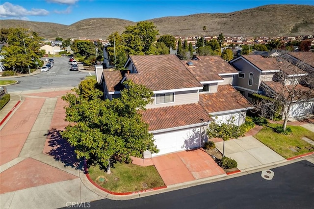 birds eye view of property featuring a mountain view