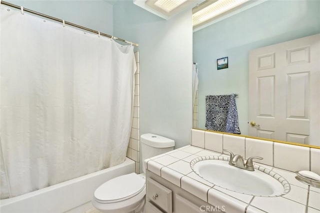 full bathroom featuring vanity, toilet, and shower / bath combo with shower curtain