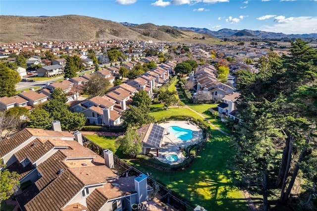 birds eye view of property with a mountain view