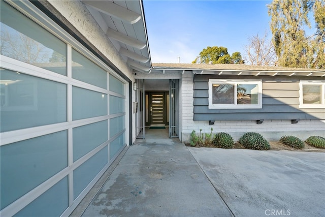 doorway to property featuring a garage