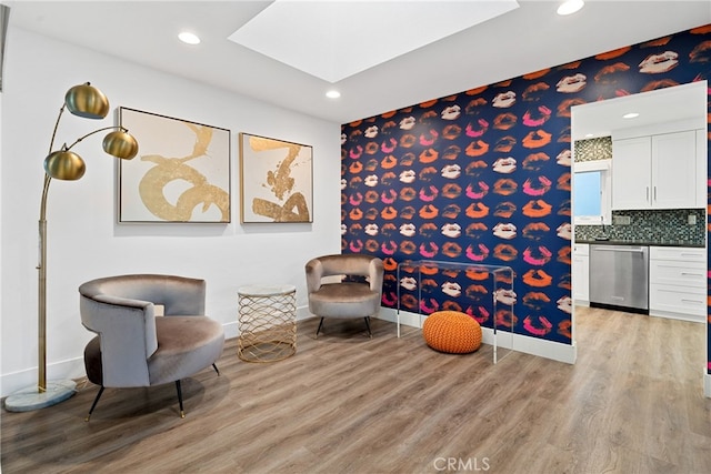 living area with light hardwood / wood-style floors