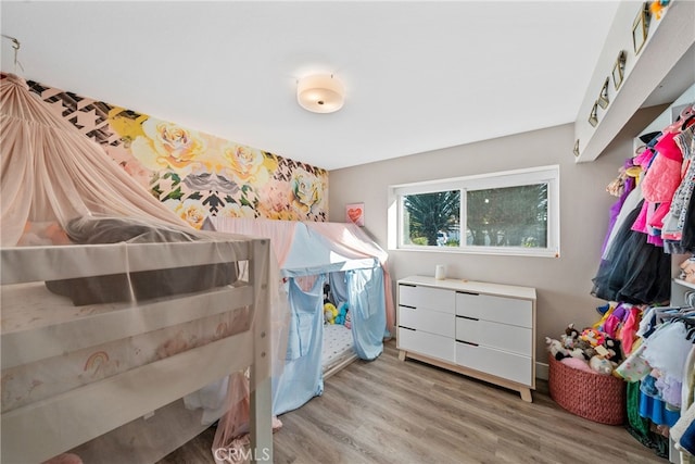 bedroom with light wood-type flooring