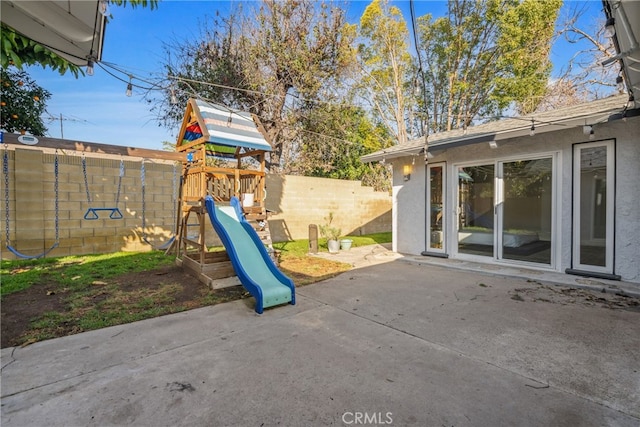 view of patio featuring a playground