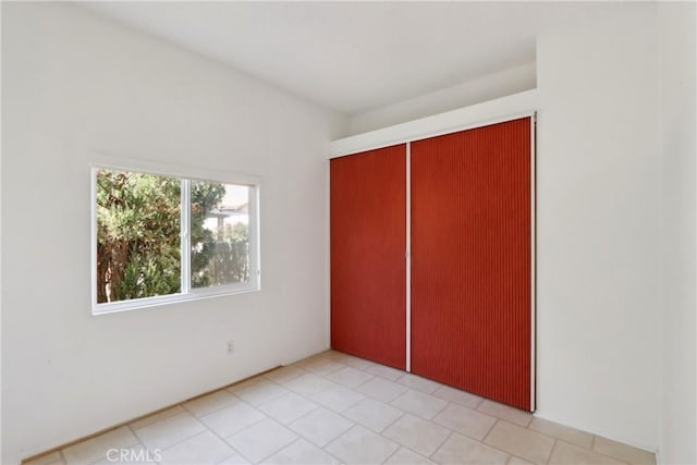 unfurnished bedroom with a closet