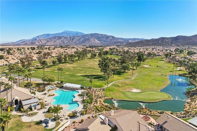 drone / aerial view with a water and mountain view