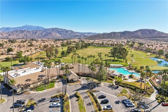 drone / aerial view with a water and mountain view