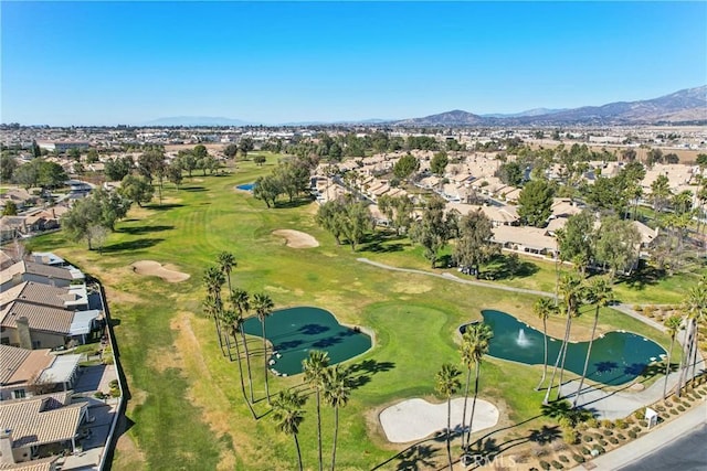 birds eye view of property featuring a water and mountain view