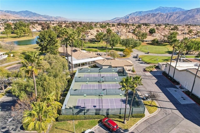 birds eye view of property featuring a water and mountain view