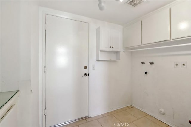 washroom with cabinets, hookup for a washing machine, light tile patterned floors, and electric dryer hookup