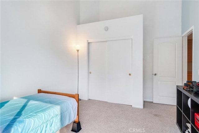 carpeted bedroom with a closet