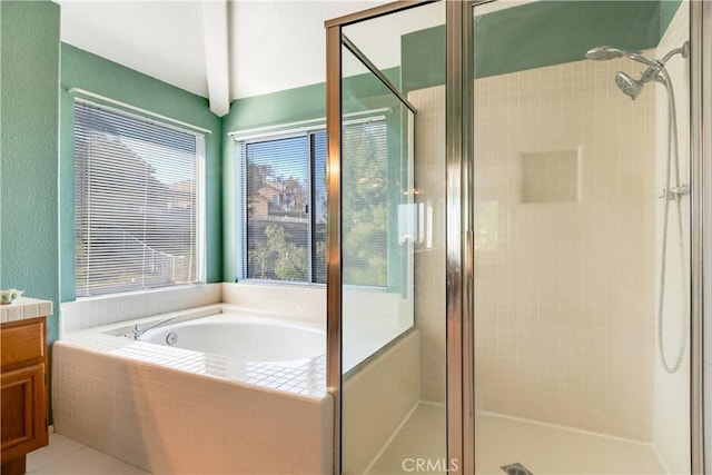 bathroom with vanity, shower with separate bathtub, and a wealth of natural light