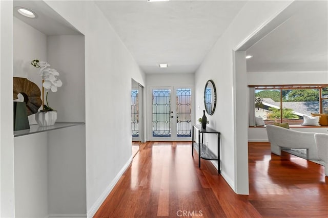 corridor featuring hardwood / wood-style floors