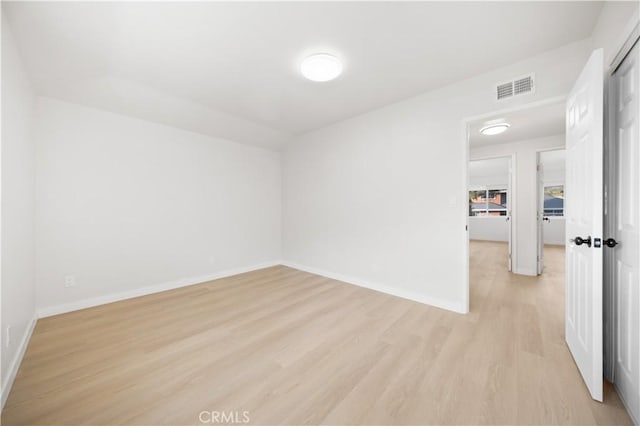 unfurnished room with light hardwood / wood-style flooring