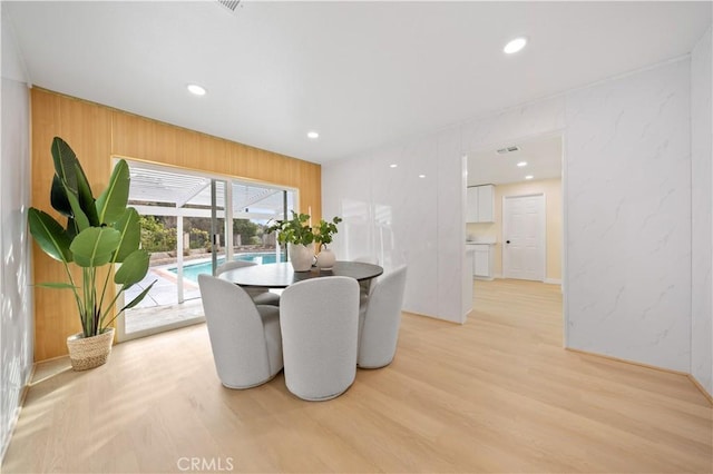 dining area with light wood-type flooring