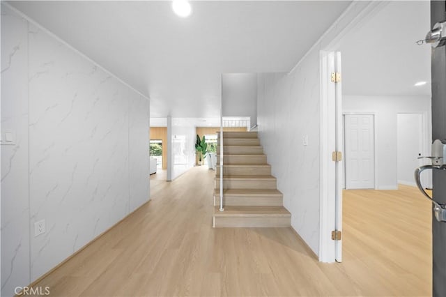 staircase with hardwood / wood-style floors