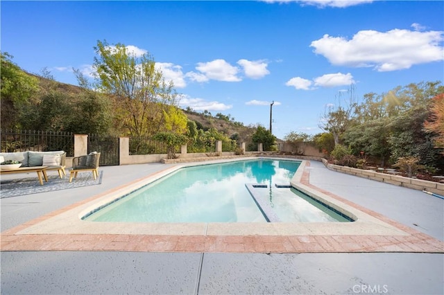 view of swimming pool featuring a patio area