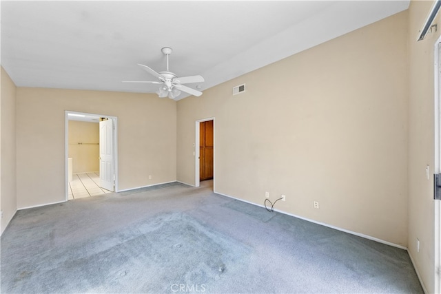 unfurnished room featuring ceiling fan and light colored carpet