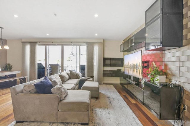 living room featuring dark wood-type flooring and a chandelier