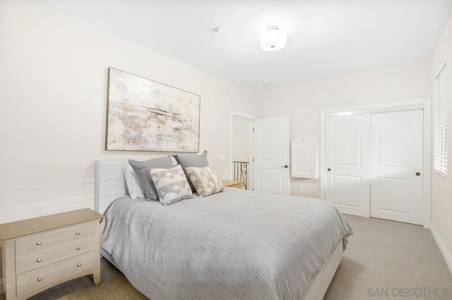 carpeted bedroom featuring a closet