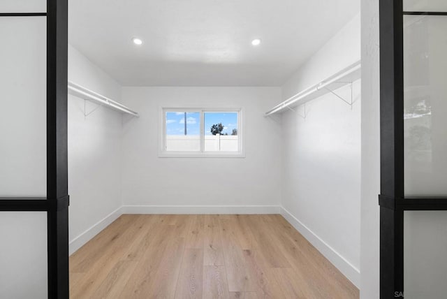 walk in closet featuring light hardwood / wood-style floors