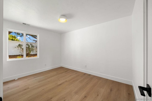 spare room with light wood-type flooring