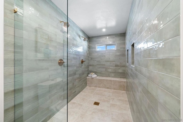 bathroom featuring a tile shower