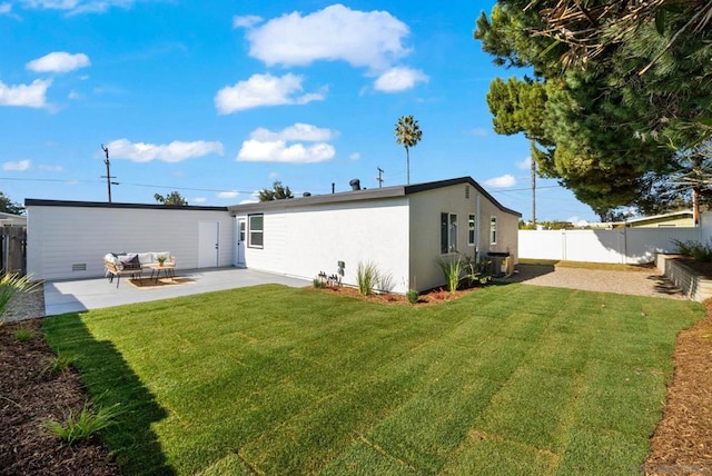 back of house with a patio, a yard, and central AC unit