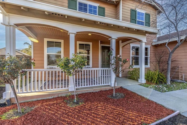 entrance to property with a porch