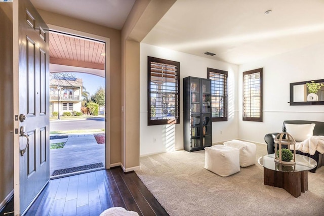 entrance foyer featuring dark hardwood / wood-style floors