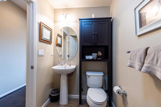 bathroom with sink and toilet