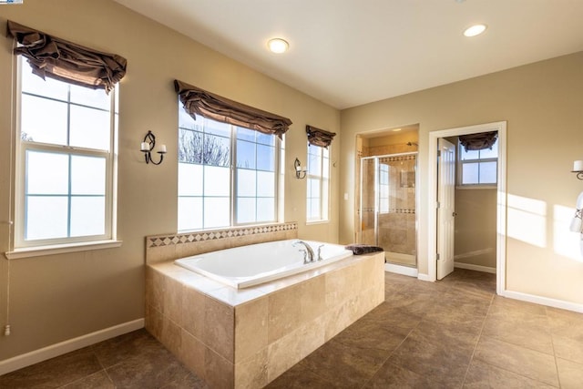 bathroom featuring independent shower and bath and tile patterned flooring