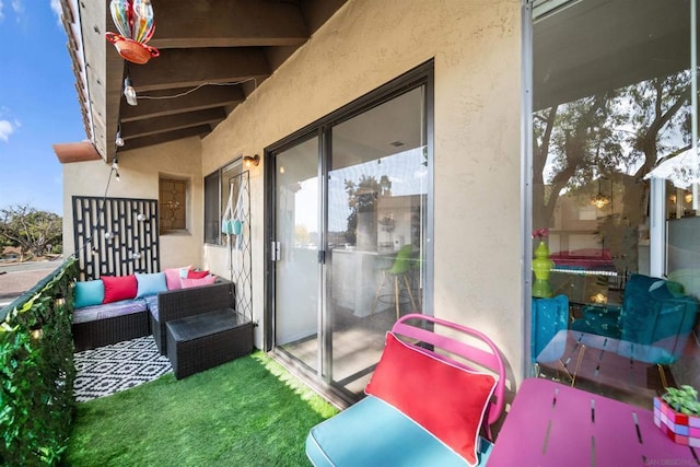 exterior space with an outdoor living space and a balcony