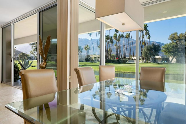 sunroom with a mountain view and a wealth of natural light