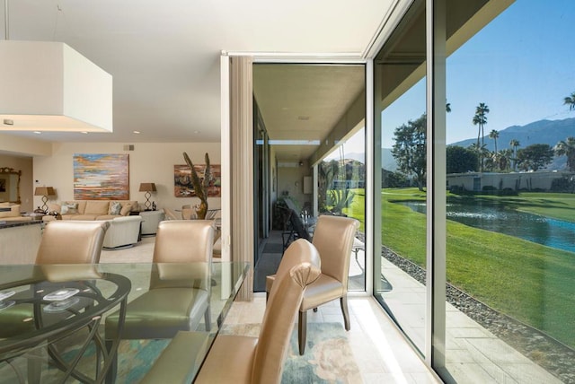 interior space with a water and mountain view