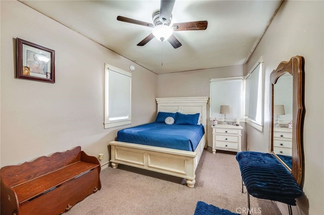 bedroom with light carpet and ceiling fan