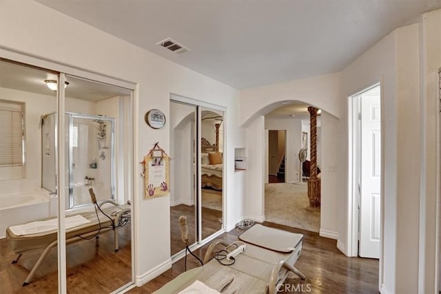 hallway featuring dark wood-type flooring