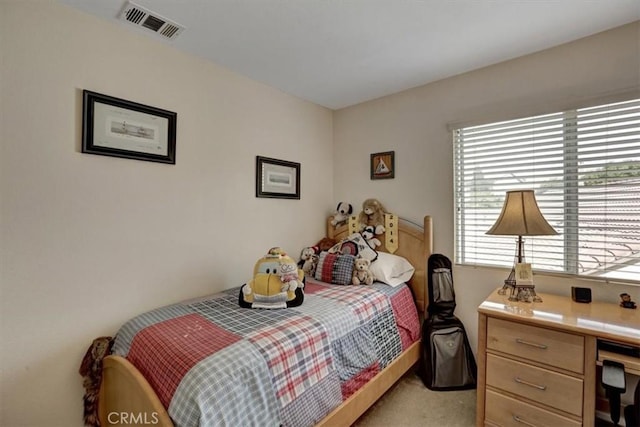 bedroom featuring light carpet