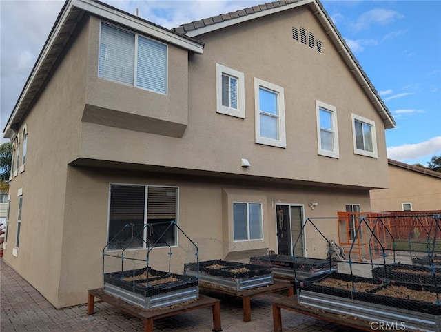 rear view of property with a patio