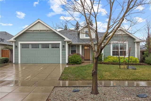 view of front facade featuring a garage and a front lawn