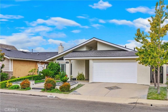 ranch-style home featuring a garage