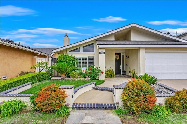 view of front of home with a garage