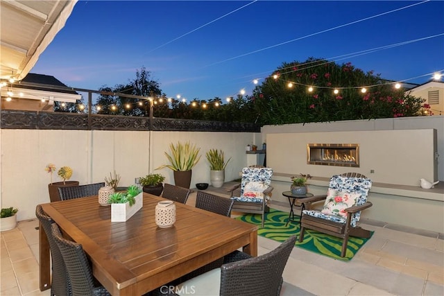 view of patio terrace at dusk